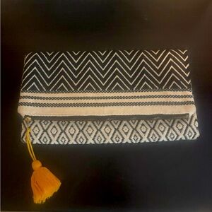 Tribe Alive + Canary Clutch